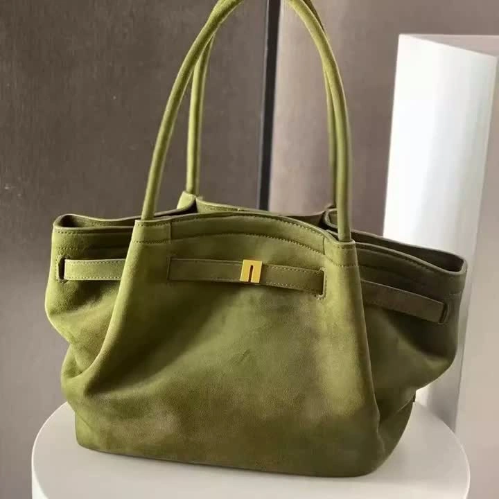 Olive green suede handbag with gold hardware